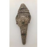 A Sino-Tibetan white metal mounted conch Shankha, relief decorated with Buddhist figures, length