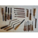 A collection of chisels and gouges, to include: firmer chisels, trowel shank paring chisels, carving