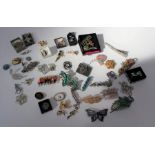 A selection of thirty seven brooches plus interesting hair clips- mid century, contemporary