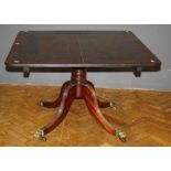 A married George III mahogany breakfast table, the rectangular tilt top with a reeded edge, on a