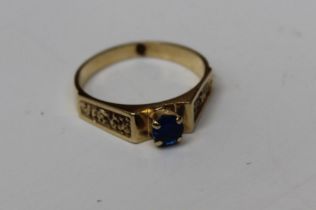 A single blue paste stone solitaire ring, size N, gross weight approx 2.7gm, unmarked