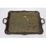 A large early 19th century style silver plated tray, the oblong shape enclosed by a shell and