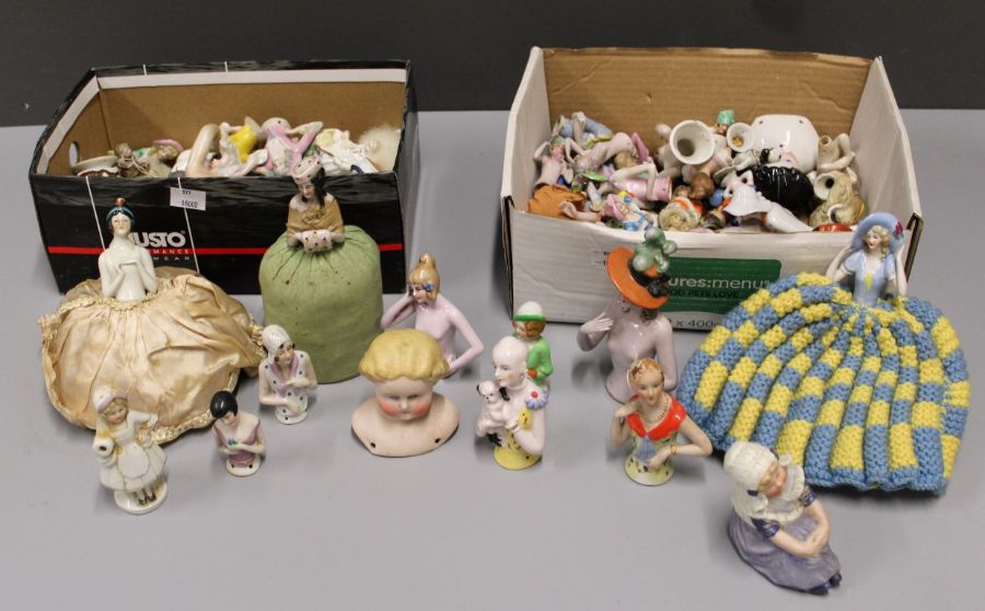 A collection of several dozen early/mid 20th century pin cushion bisque and other dolls and other