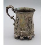 I F P C and Co, a Victorian silver christening mug, decorated with figural panels around a leaf