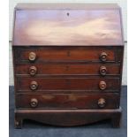 A 19th century mahogany bureau, the fall enclosing a simply fitted interior, over four graduated