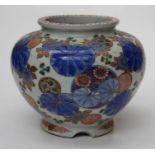 A large Japanese porcelain jardiniere / fish bowl, the body painted with flowers, leaves and
