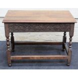 An 18trh century style oak side table, the rectangular planked top over blind fret carved frieze, on