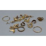 A quantity of gold and yellow metal jewellery to include rings (cut shanks), earrings and others.