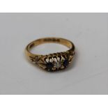 An 18ct gold three stone ring, two sapphires and an old mine cut diamond, gross weight approx 4.3gm,