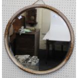 A circa 1930's mottled and gilt composite wall mirror with floral swag decoration and bevelled