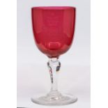 A 19th century cranberry glass wine glass, etched with Royal Cypher VR (Victoria Regina) beneath a