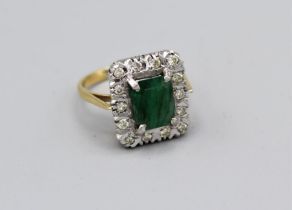 An emerald and diamond cluster ring in yellow and white metal, size Q, approx 6.5gm in vintage case,