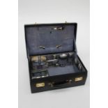 An early 20th century blue hide vanity case, fitted with matched silver and white metal mounted