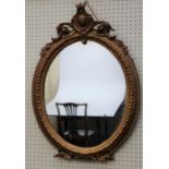 A 19th century giltwood and gesso wall mirror, with florally pierced lyre-form surmount and beaded