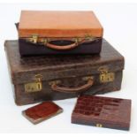 Mappin and Webb. an early 20th century lady's crocodile hide vanity case, with brass furniture and