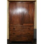 A 19th century mahogany linen press, the moulded cornice over a pair of panel doors enclosing four