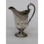 An Edward and John Barnard Ewer shaped cream jug with D monogram engraved into cartouche, approx