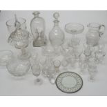 A large group of mainly nineteenth century glass ware. To include: a covered jar, two decanters,