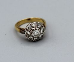 A diamond target ring featuring a central round brilliant cut diamond estimated 0.40ct plus eight