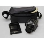 Hasselblad, a 500c/m SLR camera, fitted Zeiss 1:2, 8 planar lens number 6204418, together with a