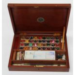 A mid 20th century mahogany artist's box, ' Reeves' water colour box, no 31, 29cm wide
