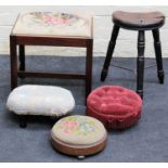 A rustic elm stool on three turned legs, a Victorian woolwork upholstered foot stool, two other foot