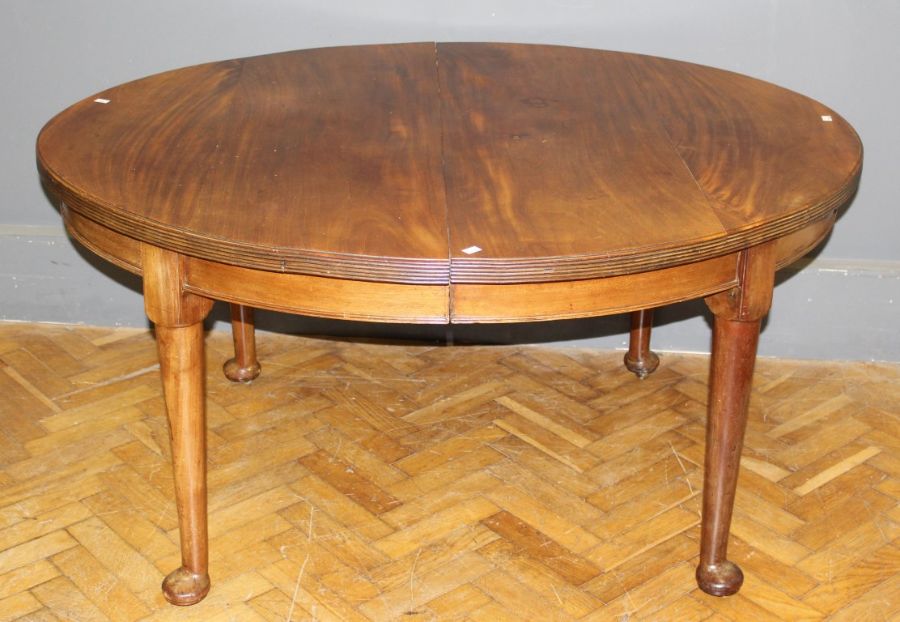 A late 19th century mahogany, winding extending dining table, the oval top and two inset leaves with