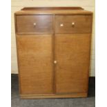 A Heals style Art Deco mahogany side cabinet having two short drawers over a pair of panel doors,