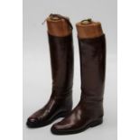Pair of vintage brown riding boots including heavy boot jacks with brass rings