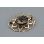 A smoky quartz set open work brooch in 9ct yellow gold, hallmarked Birmingham 1964 by Ward Brothers,