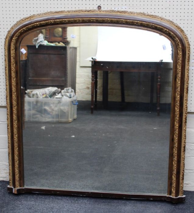 A 19th century style overmantle mirror, the gilt composite and simulated burr wood frame enclosing a