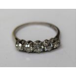 A white metal five stone diamond ring marked PLAT, gross weight approx 2.9gm, size M1/2. Estimated