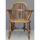 A 19th century double hoop and stick back Windsor armchair with yew rails, elm saddle seat, on