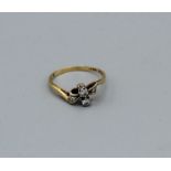 Art Deco diamond bow ring in yellow metal stamped 18ct and Plat, gross weight 2.6gm, size O