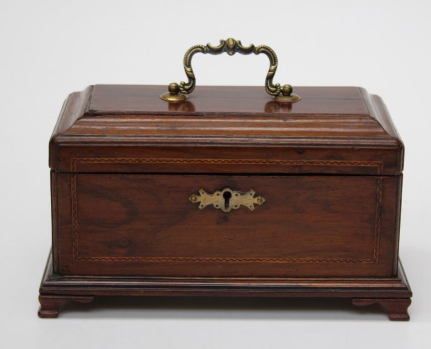 A George III mahogany, chequer strung tea caddy with three division covered interior, on later