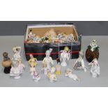 A collection of several dozen bisque piano babies, Christmas cake decorations and other similar