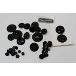 A collection of French jet mourning buttons, plus a pair of Vauxhall glass buckles