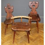 A rustic 19th century Tyrolean stool with low bow back, solid seat on four splayed legs, 41cm (top