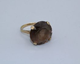 A large smoky Quartz cocktail ring, size R, in 9ct gold, gross weight 8.7gm