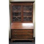 A 19th century mahogany bureau bookcase, the moulded cornice over a pair of astragal glazed doors