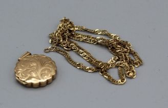 A 9ct gold scallop edge locket with a twisted curb chain. Gross weight approx 8.4gm