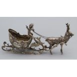 A Hanau silver model of a reindeer and sleight driven by a cherub, marked under sleigh, import marks