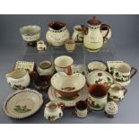 A large group of Torquay motto ware including bowls, plates, jugs etc. In good overall condition,