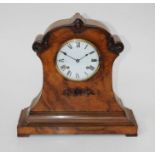 A late 19th century walnut cased director's/library clock of waisted form with applied floral