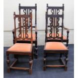 A set of eight late 19th century oak high back dining chairs each with florally carved rail,