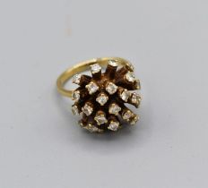 A diamond bombe ring in yellow metal, shank stamped 18ct. Gross weight 9.8gm, size M, estimated