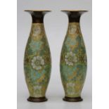 A pair of tall Royal Doulton Slater's Patent vases, each with green, white and blue pressed lace