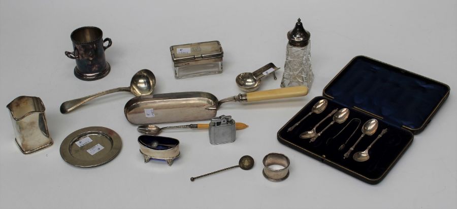 A quantity of silver and silver plate comprising a glass silver topped box, a silver cigar rest, a