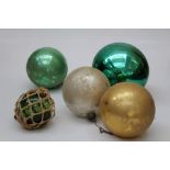 A collection of seven Edwardian glass Christmas baubles, all plain globes comprising 1 giant