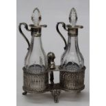 A Victorian oil and vinegar set, dated 1886 for London with pierced silver base and attractive cut